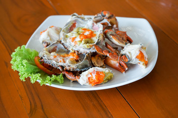 steamed crab with crab's eggs on white plate, Thai seafood