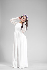 Fototapeta na wymiar Young arabic woman in white sexy dress