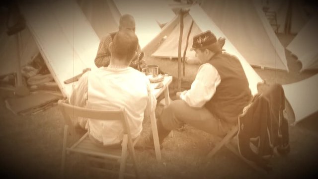 Civil War soldier sitting around the encampment(Archive Footage Version)