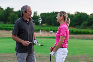 senior golfer couple