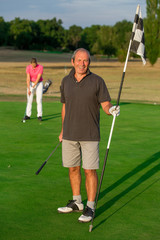 Fototapeta premium Happy Senior Couple Playing Golf