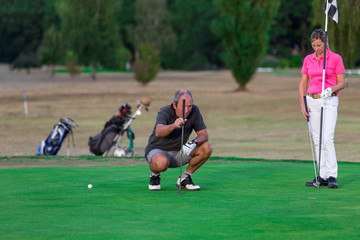 Obraz premium Senior Couple Enjoying Game Of Golf