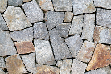 old stone wall Texture in weathered and have natural surfaces.