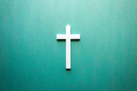 white cross on a green background