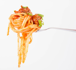 Spaghetti bolognese being eaten with a fork