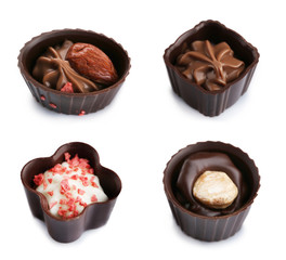 Collage of delicious chocolate candies on white background