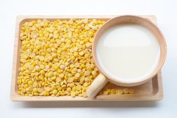 Soy milk and soy in wooden bowl healthy food.
