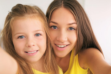 Cute girl with mother, closeup