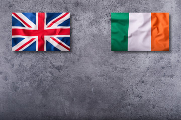 Flags of the united kingdom and ireland on concrete background.