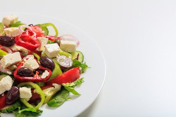 Greek salad on white background
