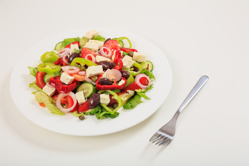 Greek salad on white background