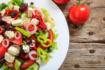 Greek salad on wooden background