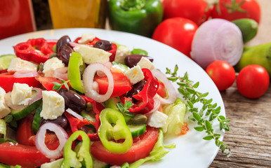 Greek salad on wooden background