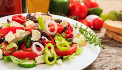 Greek salad on wooden background