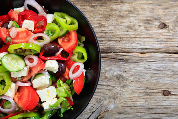 Greek salad on wooden background