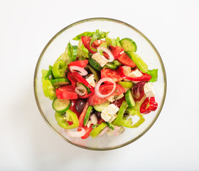 Greek salad on white background