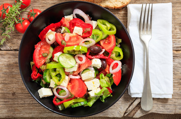 Greek salad on wooden background