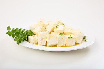 Feta cheece pieces on white background