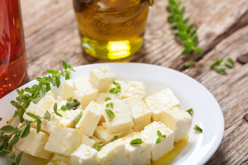 Feta cheece pieces on wooden background