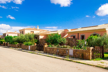 Fototapeta premium SAN TEODORO, ITALY is a typical seaside Sardinian town. villas for rent homes, cute Italian street