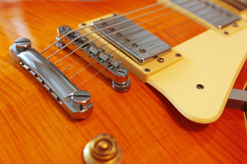 Closeup of the solid body electric guitar. Detail, selective focus.