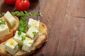 Feta cheece pieces on wooden background