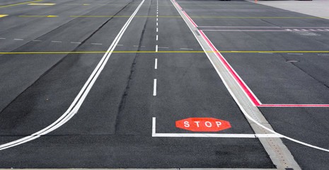 Airfield runway with signs.