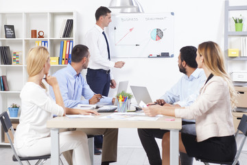 Fototapeta premium Business partners discussing documents and ideas at meeting