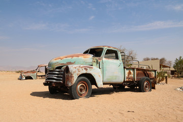 Old cars - wrecks in the african desert - oldtimer - autowracks - solitaire - obrazy, fototapety, plakaty
