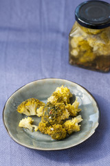 Pickled broccoli in a jar