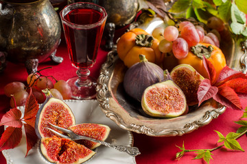 Autumn still life with figs and berry infusion