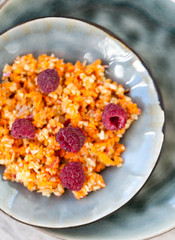 Fruit salad with apples, carrots and raspberries