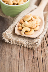 Fototapeta na wymiar Cashew nuts on a wooden spoon