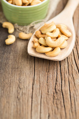 Cashew nuts on a wooden spoon