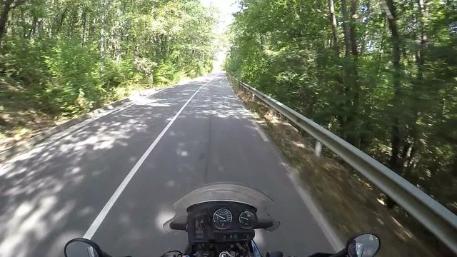 Riding Motorcycle in a Tree Shadows
