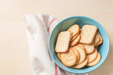 crackers cheese and crackers sugar in color bowl on wood table,