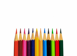 Drawing supplies: assorted color pencils on white background
