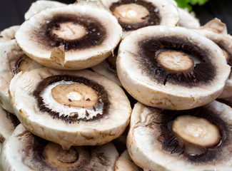Snack of dried mushroom caps aged over charcoal