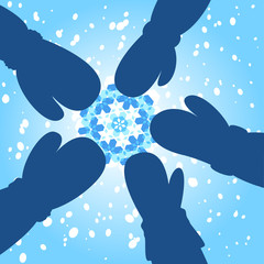 Gloved hands touching a snowflake Christmas design