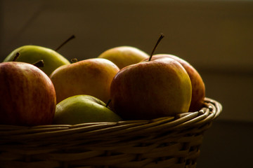 Multicolored apples in a basket