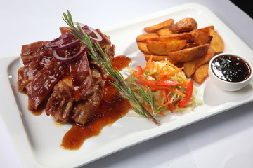 pork ribs with sauce and rosemary