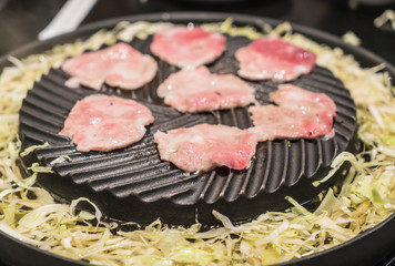 pork sliced grilling on pan