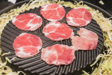 pork sliced grilling on pan