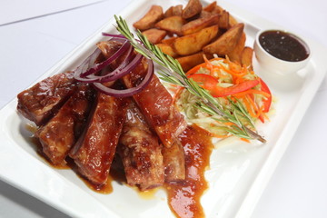 pork ribs with sauce and rosemary