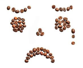 sad smiley made of coffee beans on white background