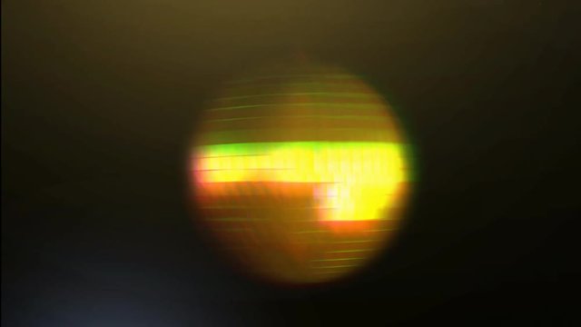 A 15 second loop of a gold disco ball rotating and randomly bouncing with paparazzi flashes. HD 1080.