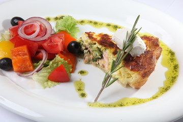 fish pie with vegetables on plate