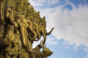 Fototapeta na wymiar close-up ganesha statue and sky clouds