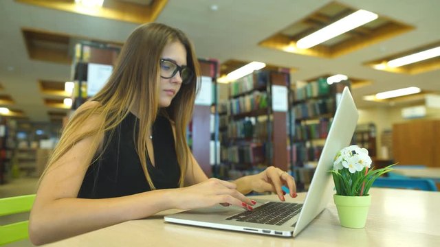 Beautiful female student in a university library