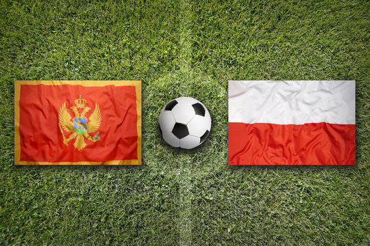 Montenegro vs. Poland flags on soccer field